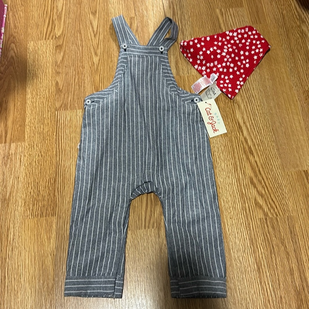 New with tags, size 6-9 months, cat and Jack brand. Pinstripes overalls.